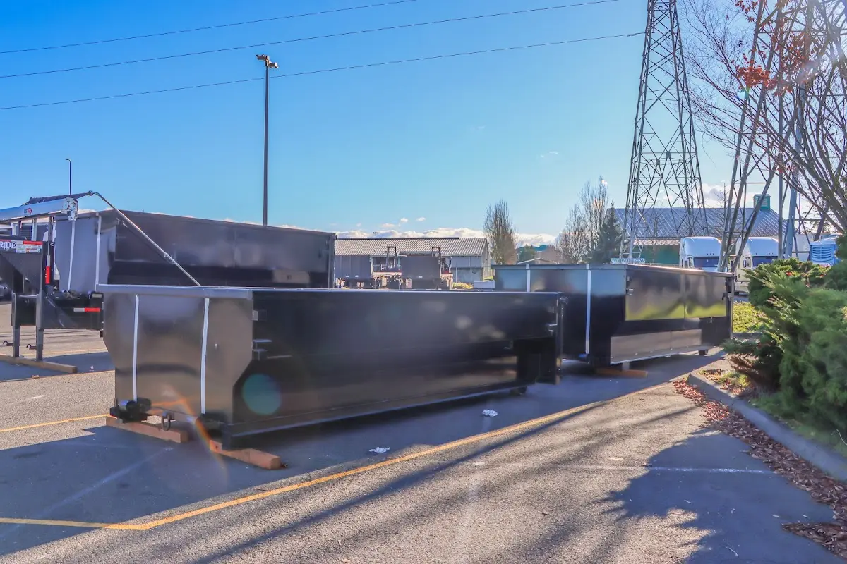 Roll-off dumpster ready for waste disposal at job site for 2 Yard Dumpster Rental in Milan